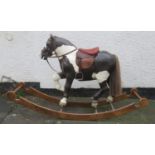 Vintage APES hand decorated child's rocking horse, mounted on wooden stand. Approx. 113cm H x