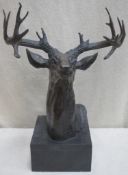 Early/mid 20th century bronze effect bust of a stag, mounted on black slate plinth. Approx. 49cm