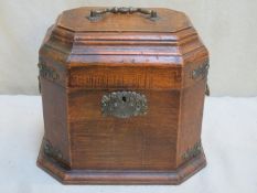 Brass bound mahogany octagonal decanter box, with hinged cover. Approx. 25cm H x 29.5cm W