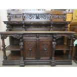 19th century heavily carved oak serving buffet/sideboard, fitted with two drawers, two cupboard