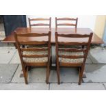 20th century carved oak refectory style dining table, with four ladderback chairs