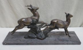 Impressive French Art Deco bronze figure group, depicting a galloping deer and fawn, mounted on