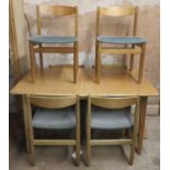 Mid 20th century teak extending dining table with one leaf and six chairs