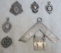 Four various hallmarked silver fobs, enamelled badge, plus masonic past masters jewel. Weight