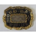 Early victorian unhallmarked yellow metal and enamelled mourning brooch