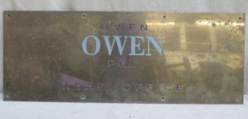 Vintage enamelled Owen Owen head office brass wall plaque. Approx 35 x 79cm