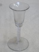 18th / 19th century inverted bell form wine glass, with air twist stem. Approx. 15.5cms hieght.