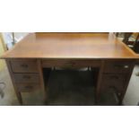 Mid 20th century oak office desk, fitted with seven drawers & two slides. Approx. 77cms H x 152cms W