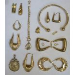 Parcel of scrap gold including earrings, St George and dragon pendant, charms etc. Approx total