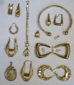 Parcel of scrap gold including earrings, St George and dragon pendant, charms etc. Approx total