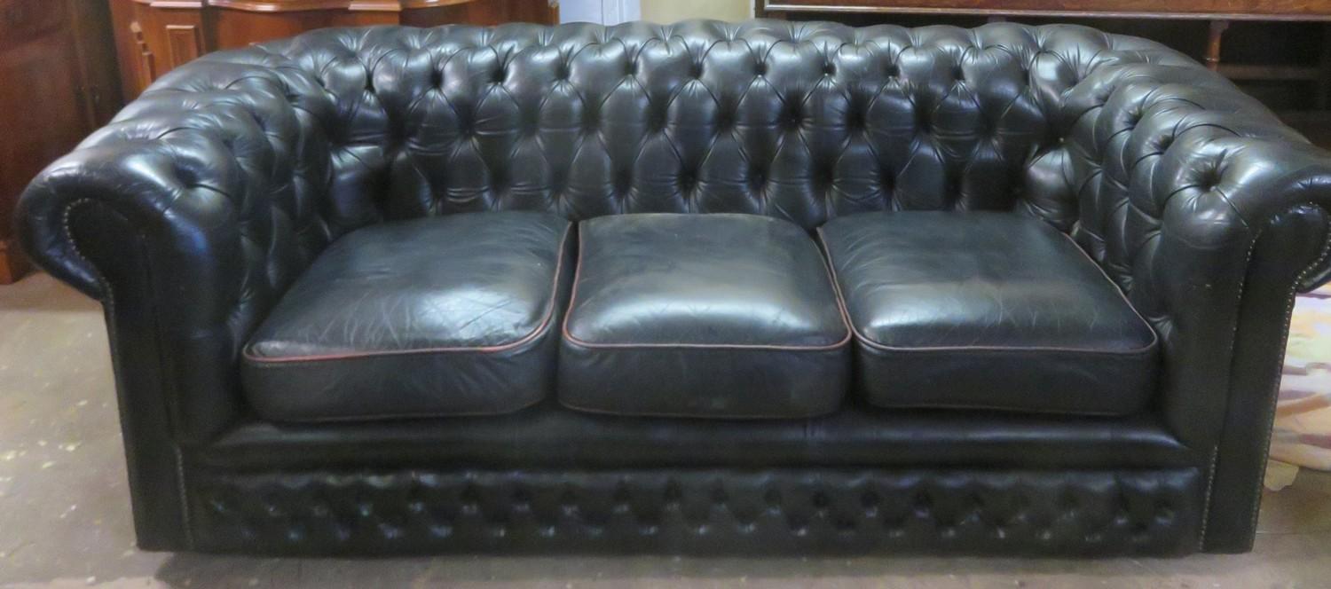 20th century upholstered Chesterfield style button back three seater settee. Approx. 69cm H x