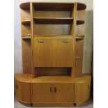 G-Plan, mid 20th century teak wall unit with drop down front, plus pair of corner shelf units to