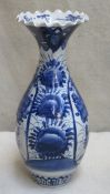 Pair of 19th/early 20th century oriental blue and white glazed ceramic crimped rimmed vase, with