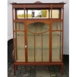 Edwardian mahogany single door glazed display cabinet, with mirrored back and galleried top,