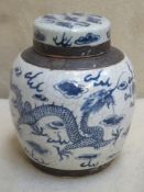 19th century Chinese blue and white ginger jar with cover, decorated with mythical dragons.