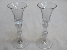 Pair of 18th / 19th century inverted bell form wine glass, with multiple knop air twist stems.