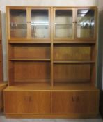 G-Plan, mid 20th century teak four door glazed wall display unit, with cupboard doors and open