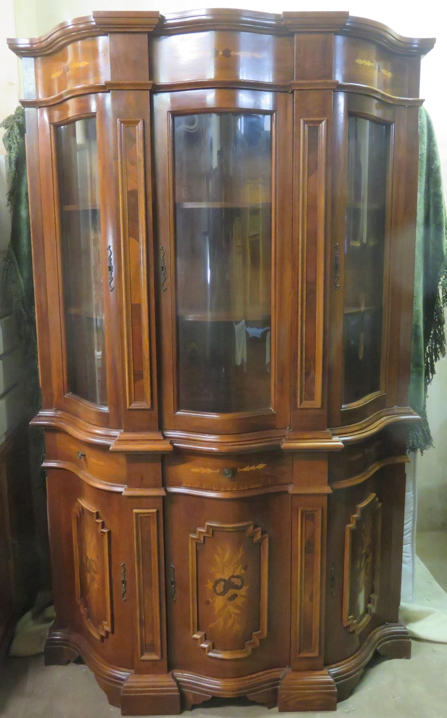 20th century inlaid mahogany Italian style serpentine fronted three door glazed display cabinet.