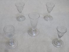 Parcel of five 18th / 19th century stemmed drinking glasses, various sizes, all with etched