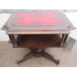 20th century mahogany two tier side table, with oxblood leather effect top, on quadrafoil