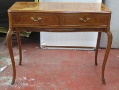 20th century walnut veneered two drawer serpentine fronted side table. Approx. 77cm H x 108cm W x