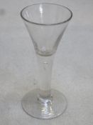 18th / 19th century trumpet form air bubble stemmed wine glass. Approx. 16.5cms height.