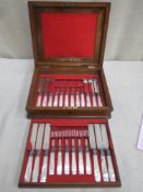 Mid 19th century walnut veneered canteen case of 12 silver plated knives and forks, all with