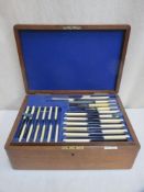 Early 20th Century Oak cased part canteen of silver plated cutlery, by Walker & Hall