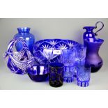 A collection of blue Bohemian and other glass.