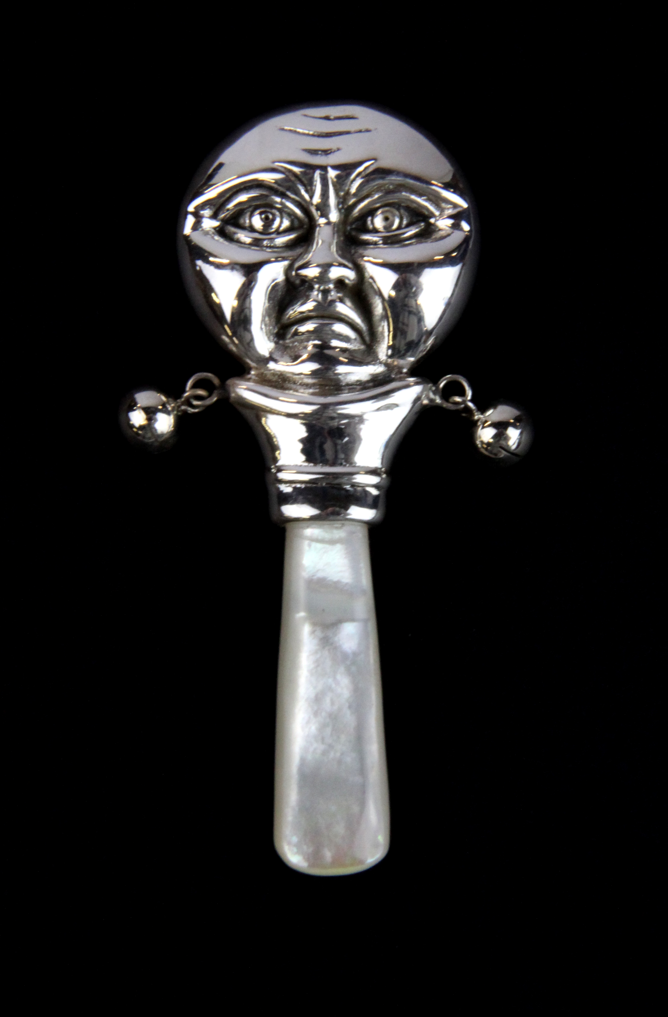 A sterling silver and mother of pearl man in the moon baby rattle, L. 8cm. - Image 2 of 3