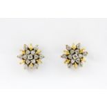 A pair of 18ct yellow and white gold (stamped 750) diamond set cluster earrings, approx. 1ct
