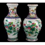 Two Chinese hand painted porcelain vases of the same pattern but different shaped bodies, H. 41cm.