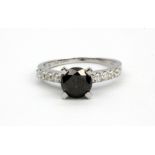 An 18ct white gold solitaire ring set with a 1.75ct brilliant cut black diamond and diamond set