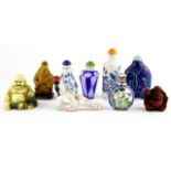 A quantity of Chinese snuff bottles and other Oriental items.