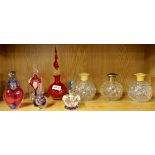 A pair of 1920's cut glass perfume bottles and a quantity of further perfume bottles.