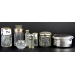 Seven hallmarked silver and cut glass perfume bottles together with a small hallmarked silver powder