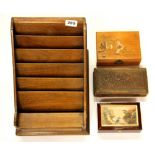 A wooden letter rack and three wooden boxes.
