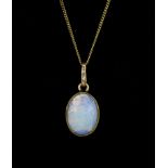 A yellow metal (tested 18ct gold) opal set pendant on an 18ct gold chain, L. 2cm.