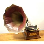 An oak cased wind up grammophone, H. 63cm L. 65cm.