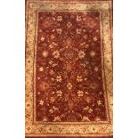 A large red wool rug, size 199 x 299cm.