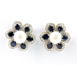 A pair of 14ct white gold (stamped 585) sapphire, pearl and diamond set flower shaped earrings, (one