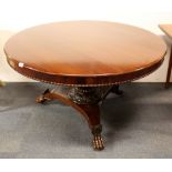 A Georgian mahogany circular pedestal dining table with lion's paw feet, Dia. 123cm.