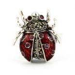 A 925 silver and marcasite enamelled spider shaped ring set with rubies, (P).