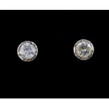 A pair of yellow metal (tested 18ct gold) stud earrings set with fancy yellow diamonds (approx 0.