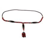 A Tibetan necklace of dzi and other semi-precious stone beads, L. 50cm.