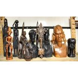 A quantity of African carved ebony and other wooden figures, tallest H. 39cm.