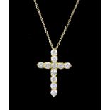 A 14ct yellow gold cross pendant and chain set with brilliant cut diamonds, approx. 2.03ct