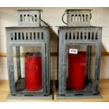 A pair of large metal storm lanterns, H. 45cm.