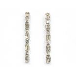 A pair of 18ct white gold (stamped 18k) baguette and brilliant cut diamond set drop earrings,