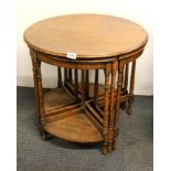 A 1930's oak circular nest of tables, Dia. 61cm H. 56cm.